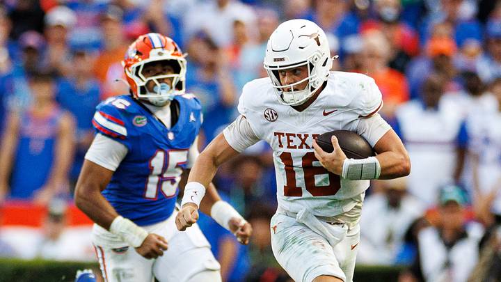 Texas Longhorns quarterback Arch Manning (16) runs with the ball while Florida Gators defensive end Jayden Woods (15) chases during the second half at Ben Hill Griffin Stadium. Texas Longhorns quarterback Arch Manning (16) runs with the ball while Florida Gators defensive end Jayden Woods (15) chases during the second half at Ben Hill Griffin Stadium.
