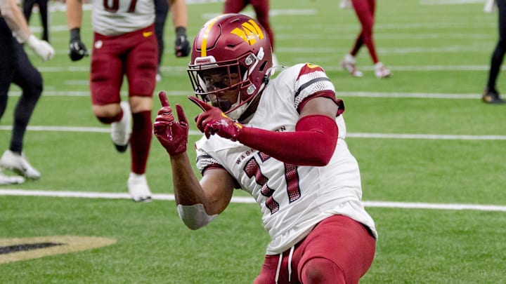 Dec 15, 2024; New Orleans, Louisiana, USA; Washington Commanders wide receiver Terry McLaurin (17) celebrates a touchdown against the New Orleans Saints cornerback Kool-Aid McKinstry (14) during the first half at Caesars Superdome. Mandatory Credit: Matthew Hinton-Imagn Images Dec 15, 2024; New Orleans, Louisiana, USA; Washington Commanders wide receiver Terry McLaurin (17) celebrates a touchdown against the New Orleans Saints cornerback Kool-Aid McKinstry (14) during the first half at Caesars Superdome. Mandatory Credit: Matthew Hinton-Imagn Images