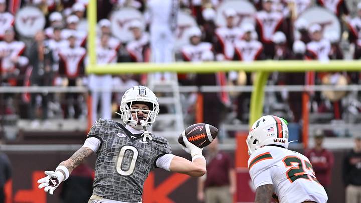 Nov 22, 2025; Blacksburg, Va.; Virginia Tech wide receiver Ayden Greene (0) throws a pass as Miami defensive back Dylan Day (23) pursues. Nov 22, 2025; Blacksburg, Va.; Virginia Tech wide receiver Ayden Greene (0) throws a pass as Miami defensive back Dylan Day (23) pursues.