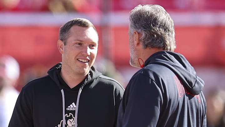 Nov 4, 2023; Salt Lake City, Utah, USA; Arizona State Sun Devils head coach Kenny Dillingham speaks with Utah Utes head coach Kyle Whittingham before a game at Rice-Eccles Stadium. Mandatory Credit: Rob Gray-Imagn Images Nov 4, 2023; Salt Lake City, Utah, USA; Arizona State Sun Devils head coach Kenny Dillingham speaks with Utah Utes head coach Kyle Whittingham before a game at Rice-Eccles Stadium. Mandatory Credit: Rob Gray-Imagn Images