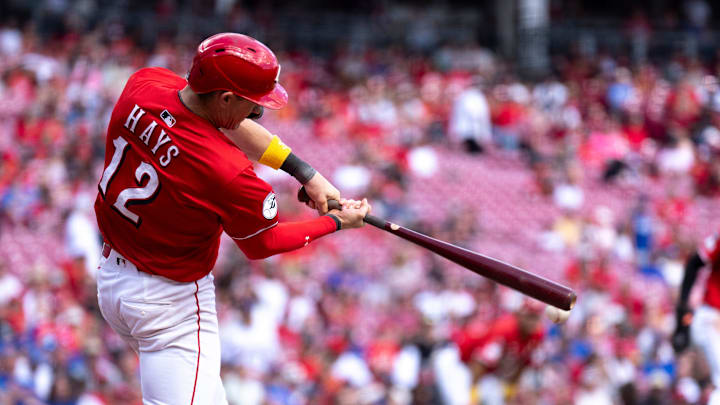 Cincinnati Reds left fielder Austin Hays (12) hits an RBI base hit in the sixth inning between Cincinnati Reds and New York Mets at Great American Ball Park in Cincinnati on Sept. 7, 2025.