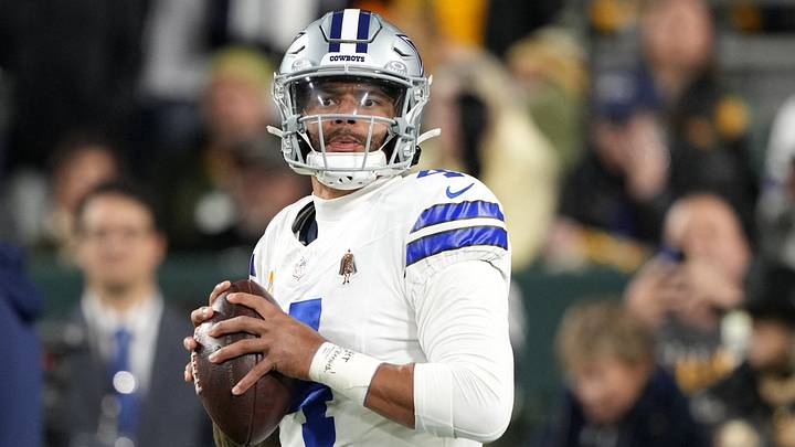 Dallas Cowboys quarterback Dak Prescott warms up prior to the game against the Green Bay Packers at Lambeau Field.