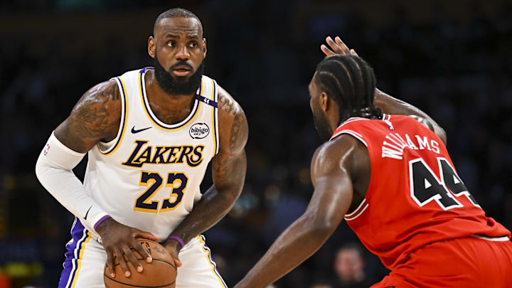 Mar 22, 2025; Los Angeles, California, USA; Los Angeles Lakers forward LeBron James (23) looks to pass against Chicago Bulls forward Patrick Williams (44) during the first half at Crypto.com Arena. Mandatory Credit: Jonathan Hui-Imagn Images