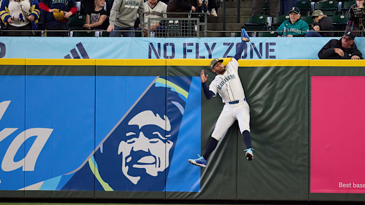 May 16, 2026; Seattle, Washington, USA; Seattle Mariners center fielder Julio Rodriguez (44) robs San Diego Padres catcher Rodolfo Duran of a home run in the ninth inning at T-Mobile Park. Mandatory Credit: Richard Dizon-Imagn Images
