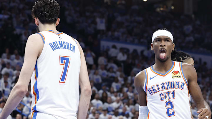 Apr 21, 2024; Oklahoma City, Oklahoma, USA; Oklahoma City Thunder guard Shai Gilgeous-Alexander (2) reacts to forward Chet Holmgren (7) blocking a shot by a New Orleans Pelicans player during the second quarter of game one of the first round for the 2024 NBA playoffs at Paycom Center. Mandatory Credit: Alonzo Adams-Imagn Images