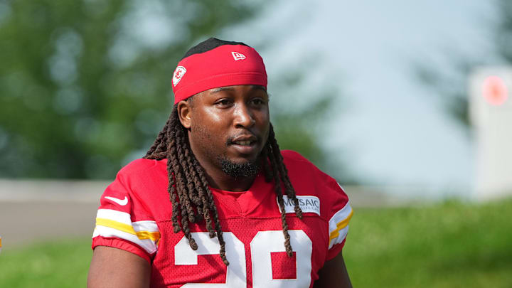Jul 22, 2025; St. Joseph, MO, USA; Kansas City Chiefs running backs Elijah Mitchell (25) and Kareem Hunt (29) walk down the hill to the fields prior to training camp at Missouri Western State University. Mandatory Credit: Denny Medley-Imagn Images