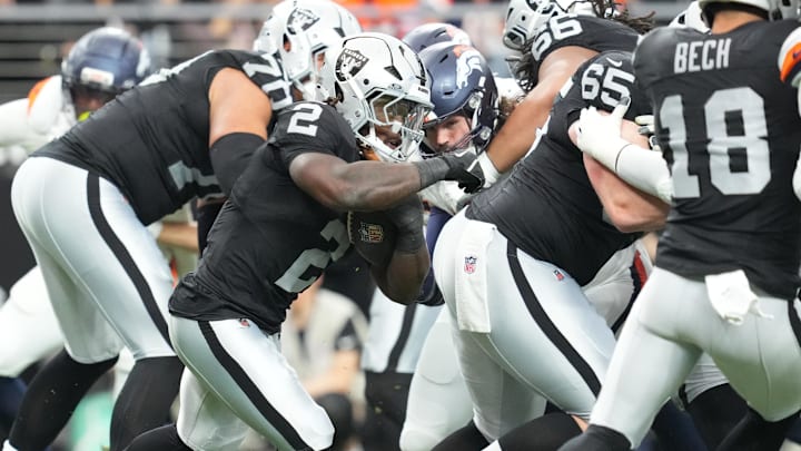 Dec 7, 2025; Paradise, Nevada, USA;  Las Vegas Raiders running back Ashton Jeanty (2) carries the ball against the Denver Broncos during the first half at Allegiant Stadium. Mandatory Credit: Stephen R. Sylvanie-Imagn Images