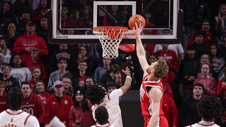 Jan 2, 2026; Piscataway, New Jersey, USA; Ohio State Buckeyes forward Brandon Noel (14) blocks a shot by Rutgers Scarlet Knights guard Jamichael Davis (1) during the first half at Jersey Mike's Arena. Mandatory Credit: Vincent Carchietta-Imagn Images
