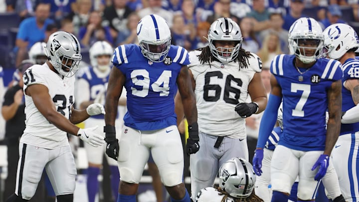 Oct 5, 2025; Indianapolis, Indiana, USA; Indianapolis Colts defensive end Tyquan Lewis (94) looks at Las Vegas Raiders running back Ashton Jeanty (2) after a play during the second quarter at Lucas Oil Stadium. 