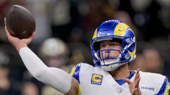 Dec 1, 2024; New Orleans, Louisiana, USA; Los Angeles Rams quarterback Matthew Stafford (9) throws against New Orleans Saints defensive end Chase Young (99) during the first half at Caesars Superdome. Mandatory Credit: Matthew Hinton-Imagn Images