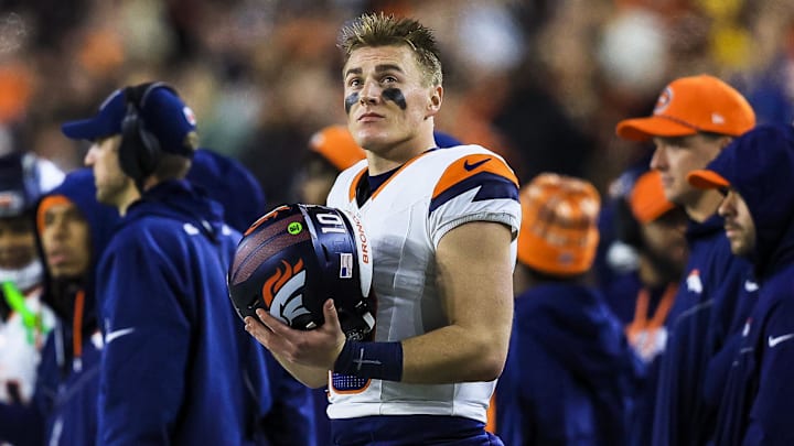 Dec 28, 2024; Cincinnati, Ohio, USA; Denver Broncos quarterback Bo Nix (10) stands on the sidelines during the second half against the Cincinnati Bengals at Paycor Stadium. 