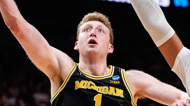 Michigan center Danny Wolf (1) goes to the basket against Auburn forward Johni Broome (4) during the second half of the Sweet 16 round of NCAA tournament at State Farm Arena in Atlanta, Ga. on Friday, March 28, 2025.