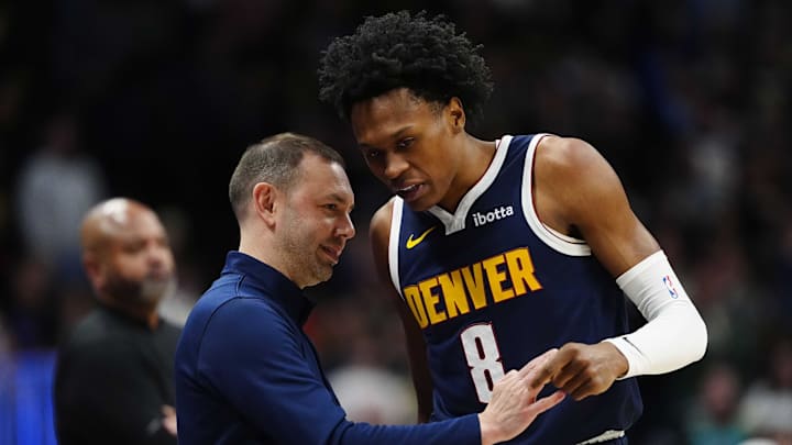 Jan 27, 2026; Denver, Colorado, USA; Denver Nuggets guard Peyton Watson (8) talks to head coach David Adelman during the first quarter against the Detroit Pistons at Ball Arena.