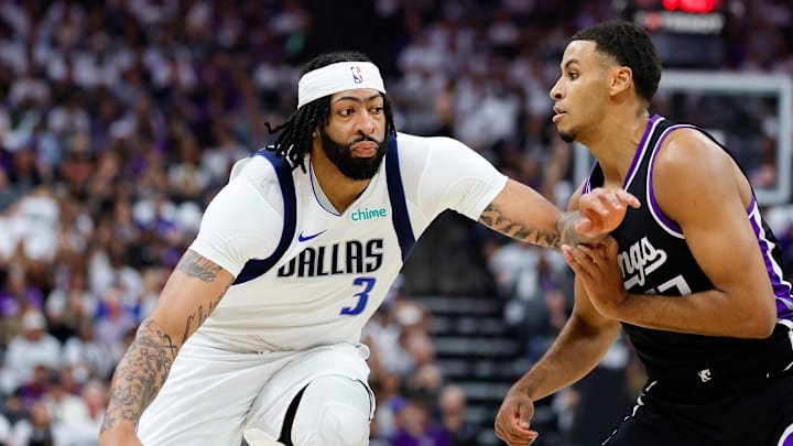 Apr 16, 2025; Sacramento, California, USA; Dallas Mavericks forward Anthony Davis (3) dribbles the ball against Sacramento Kings forward Keegan Murray (13) during the first quarter at Golden 1 Center.