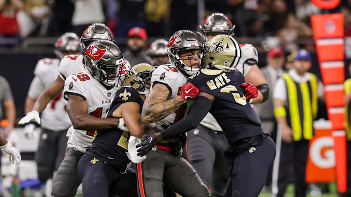Sep 18, 2022; New Orleans, Louisiana, USA;  New Orleans Saints cornerback Marshon Lattimore (23) and safety Marcus Maye (6) get into a penalty with Tampa Bay Buccaneers wide receiver Mike Evans (13) and they are ejected after the play during the second half at Caesars Superdome. Mandatory Credit: Stephen Lew-Imagn Images