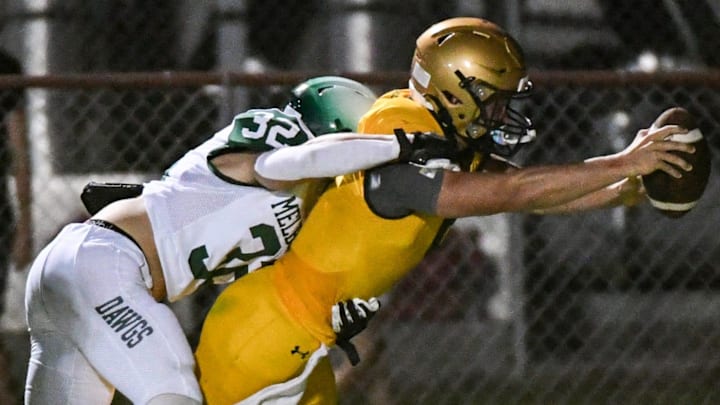 Jaxon Eagle of Melbourne brings down MCC QB Brogan McNab short of the goal line during a three team spring football jamboree Friday, May 24 2024 at Melbourne High School.. Craig Bailey/FLORIDA TODAY via USA TODAY NETWORK