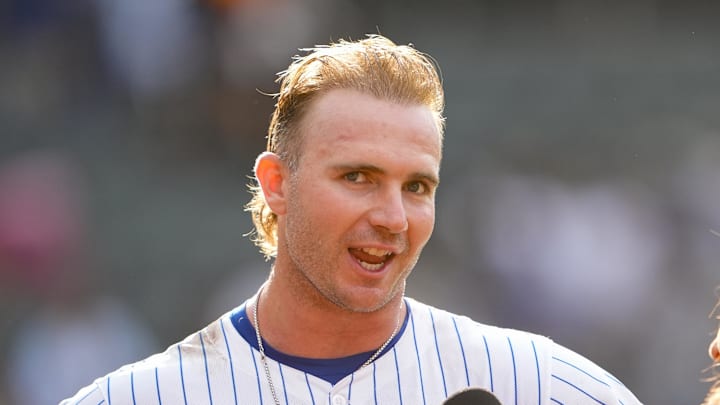 Sep 14, 2025; New York City, New York, USA; New York Mets first baseman Pete Alonso (20) conducts an interview after hitting a walk off three run home run against the Texas Rangers during the tenth inning at Citi Field. Mandatory Credit: Gregory Fisher-Imagn Images