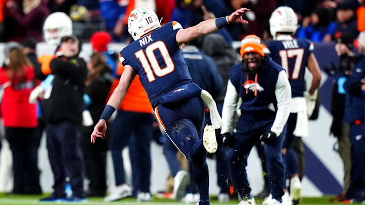 Dec 2, 2024; Denver, Colorado, USA; Denver Broncos quarterback Bo Nix (10) celebrates following a touchdown in the third quarter against the Cleveland Browns at Empower Field at Mile High. 