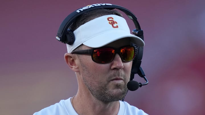 Oct 21, 2023; Los Angeles, California, USA; Southern California Trojans head coach Lincoln Riley watches from the sidelines against the Utah Utes in the first half at United Airlines Field at Los Angeles Memorial Coliseum. Mandatory Credit: Kirby Lee-Imagn Images Oct 21, 2023; Los Angeles, California, USA; Southern California Trojans head coach Lincoln Riley watches from the sidelines against the Utah Utes in the first half at United Airlines Field at Los Angeles Memorial Coliseum. Mandatory Credit: Kirby Lee-Imagn Images