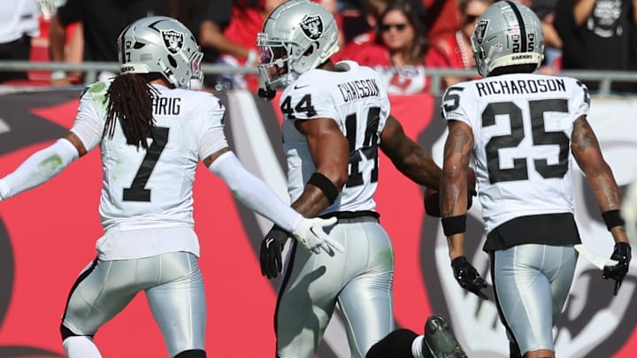 Dec 8, 2024; Tampa, Florida, USA; Las Vegas Raiders defensive end K'Lavon Chaisson (44) recovers the fumble against the Tampa Bay Buccaneers during the second quarter at Raymond James Stadium. Mandatory Credit: Kim Klement Neitzel-Imagn Images