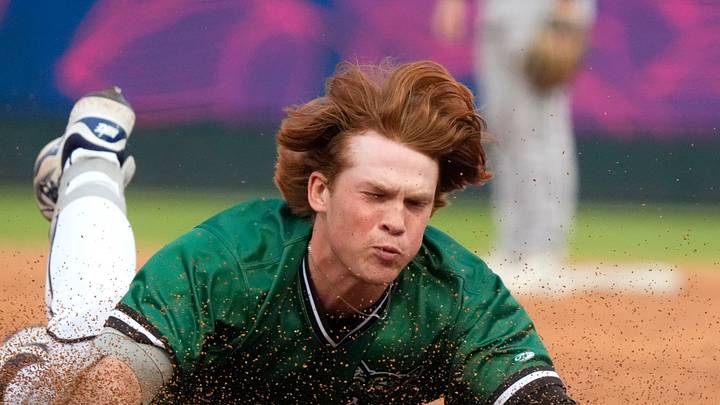 June 4, 2025; North Augusta, South Carolina, USA; Augusta GreenJacket outfielder Owen Carey (24) slides into third base during the second game of the Augusta GreenJacket and Fayetteville series at SRP Park. Mandatory Credit: Katie Goodale - Augusta Chronicle/USA TODAY NETWORK