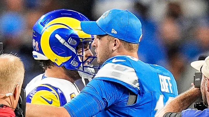 Detroit Lions quarterback Jared Goff hugs Los Angeles Rams quarterback Matthew Stafford before a coin toss for overtime in the season opener at Ford Field in Detroit on Sunday, Sept. 8, 2024.