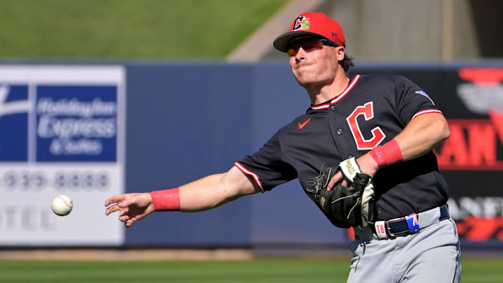 Feb 21, 2026; Phoenix, Arizona, USA;  Cleveland Guardians second baseman Travis Bazzana (72) makes a play  in the fourth inning against the Milwaukee Brewers at American Family Fields of Phoenix. Mandatory Credit: Jayne Kamin-Oncea-Imagn Images
