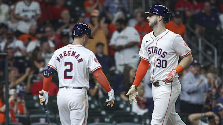 Apr 16, 2024; Houston, Texas, USA; Houston Astros right fielder Kyle Tucker (30) celebrates with third baseman Alex Bregman (2) after hitting a home run during the ninth inning against the Atlanta Braves at Minute Maid Park.