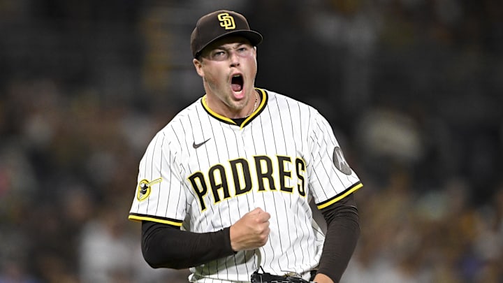 Sep 9, 2025; San Diego, California, USA; San Diego Padres relief pitcher Mason Miller (22) celebrates after striking out a batter during the eighth inning against the Cincinnati Reds at Petco Park. Mandatory Credit: Denis Poroy-Imagn Images