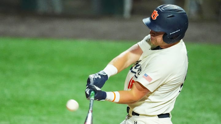 Auburn catcher Ike Irish struck in the rain on Friday night and the Tigers completed the win over the Vols on Saturday.