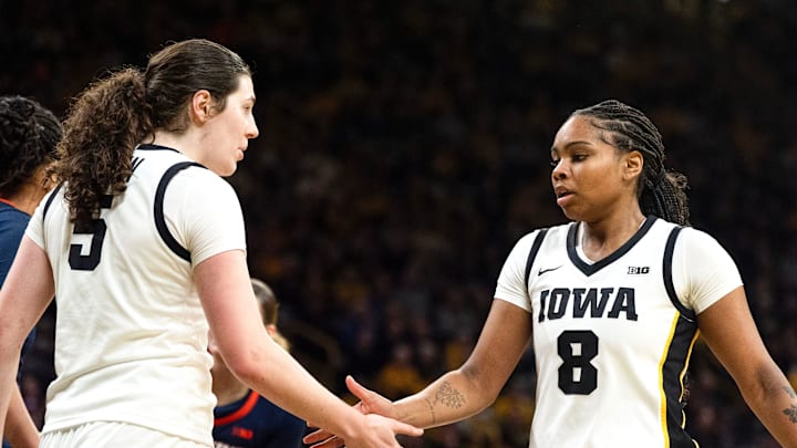 Iowa center Ava Heiden (5) high-fives Iowa guard Journey Houston (8) during a game against the Illinois Fighting Illini Feb. 26, 2026 at Carver-Hawkeye Arena in Iowa City, Iowa. Iowa center Ava Heiden (5) high-fives Iowa guard Journey Houston (8) during a game against the Illinois Fighting Illini Feb. 26, 2026 at Carver-Hawkeye Arena in Iowa City, Iowa.