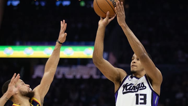 Mar 13, 2025; San Francisco, California, USA; Sacramento Kings forward Keegan Murray (13) shoots over Golden State Warriors guard Stephen Curry (30) during the first quarter at Chase Center. Mandatory Credit: D. Ross Cameron-Imagn Images