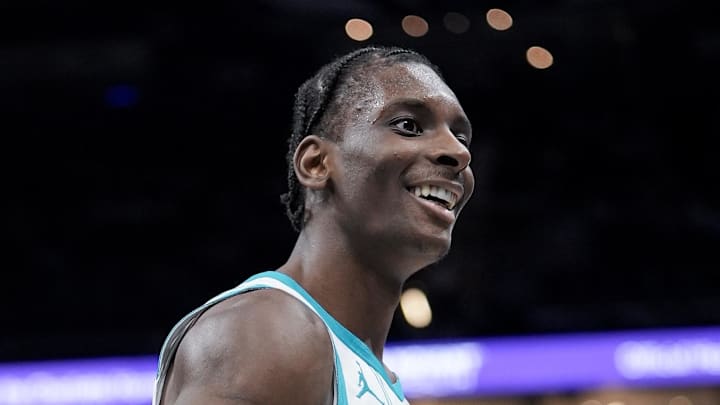 Charlotte Hornets forward Moussa Diabaté (14) reacts to chatter from Sacramento Kings guard Russell Westbrook (18) on the bench during the second half at Spectrum Center on Mar 24, 2026.
