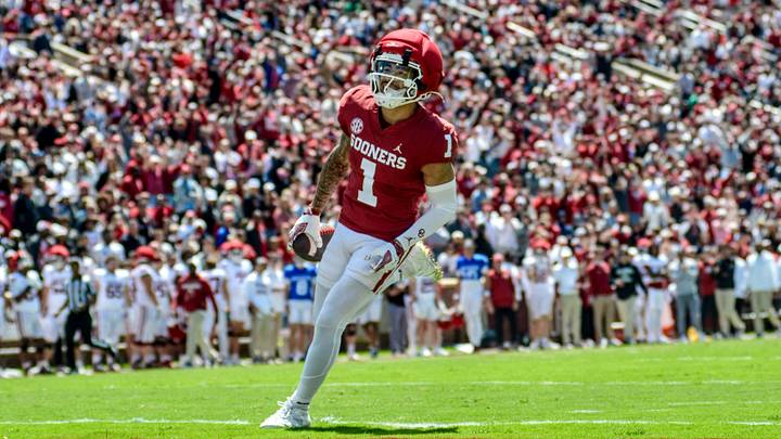 Oklahoma wide receiver Isaiah Sategna scores a touchdown in the spring game. Oklahoma wide receiver Isaiah Sategna scores a touchdown in the spring game.