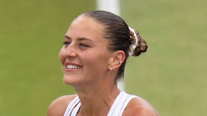 Marta Kostyuk celebrates winning her match at Wimbledon