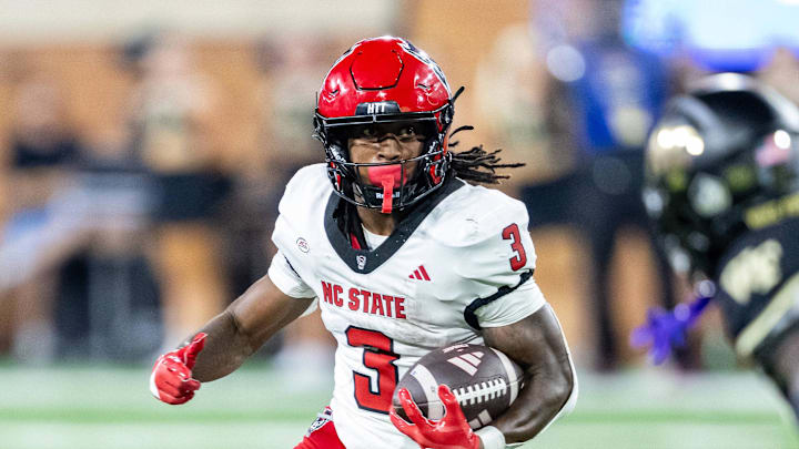 Sep 11, 2025; Winston-Salem, North Carolina, USA;  North Carolina State Wolfpack running back Hollywood Smothers (3) runs the ball in the first half against the Wake Forest Demon Deacons at Allegacy Federal Credit Union Stadium. Mandatory Credit: Luke Jamroz-Imagn Images