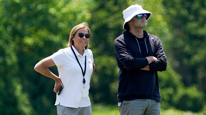 Katie Blackburn, left, and Duke Tobin, right, watch the Cincinnati Bengals practice, Wednesday, June 11, 2025, at Kettering Health Practice Fields in Downtown Cincinnati. Katie Blackburn, left, and Duke Tobin, right, watch the Cincinnati Bengals practice, Wednesday, June 11, 2025, at Kettering Health Practice Fields in Downtown Cincinnati.