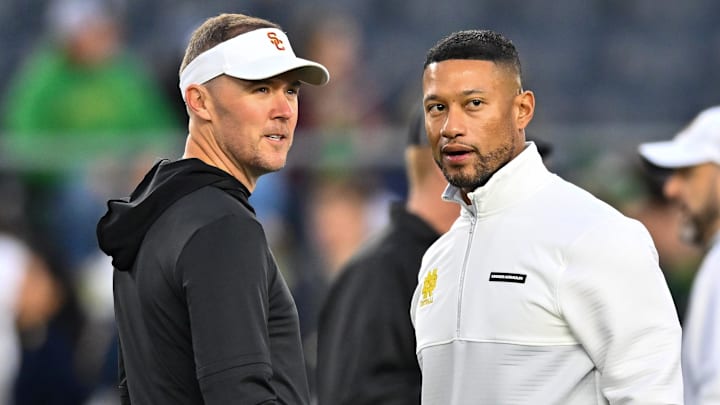 Oct 14, 2023; South Bend, Indiana, USA; USC Trojans head coach Lincoln Riley and Notre Dame Fighting Irish head coach Marcus Freeman chat before the game at Notre Dame Stadium. Oct 14, 2023; South Bend, Indiana, USA; USC Trojans head coach Lincoln Riley and Notre Dame Fighting Irish head coach Marcus Freeman chat before the game at Notre Dame Stadium.