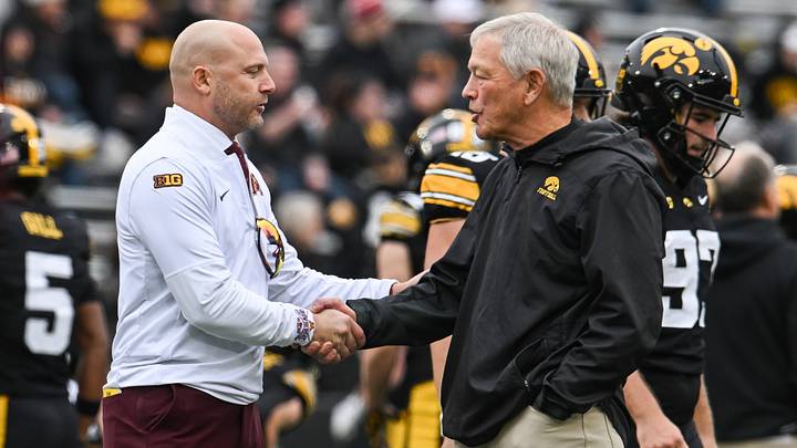 Oct 25, 2025; Iowa City, Iowa, USA; Minnesota Golden Gophers head coach P.J. Fleck (left) shakes hands with Iowa Hawkeyes head coach Kirk Ferentz before the game at Kinnick Stadium. Mandatory Credit: Jeffrey Becker-Imagn Images