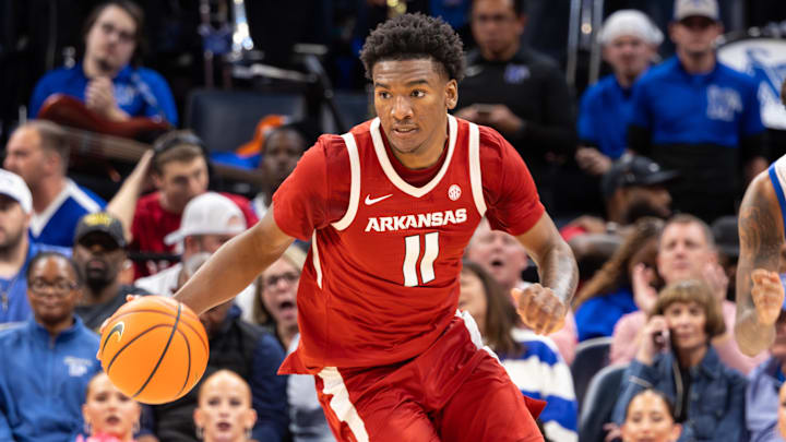 Arkansas Razorbacks guard Karter Knox (11) dribbles the ball up the court against the Memphis Tigers during the second half at FedEx Forum.