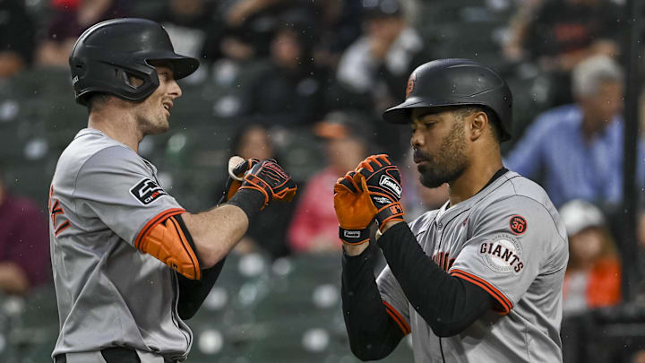 Sep 17, 2024; Baltimore, Maryland, USA;  aSan Francisco Giants outfielder Mike Yastrzemski (5 celebrates with first base LaMonte Wade Jr. (31) after hitting a first inning solo home run against the Baltimore Orioles at Oriole Park at Camden Yards.