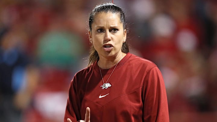 May 24, 2025; Fayetteville, AR, USA; Arkansas Razorbacks head coach Courtney Deifel signals during the sixth inning against the Ole Miss Rebels in game two of the Fayetteville Super Regional at Bogle Park. Arkansas won 4-0. Mandatory Credit: Nelson Chenault-Imagn Images