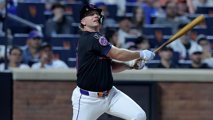 Sep 19, 2025; New York City, New York, USA; New York Mets first baseman Pete Alonso (20) follows through on a single against the Washington Nationals during the first inning at Citi Field. Mets shortstop Francisco Lindor (not pictured) scored on the play on an error by Nationals right fielder Dylan Crews (not pictured). Mandatory Credit: Brad Penner-Imagn Images