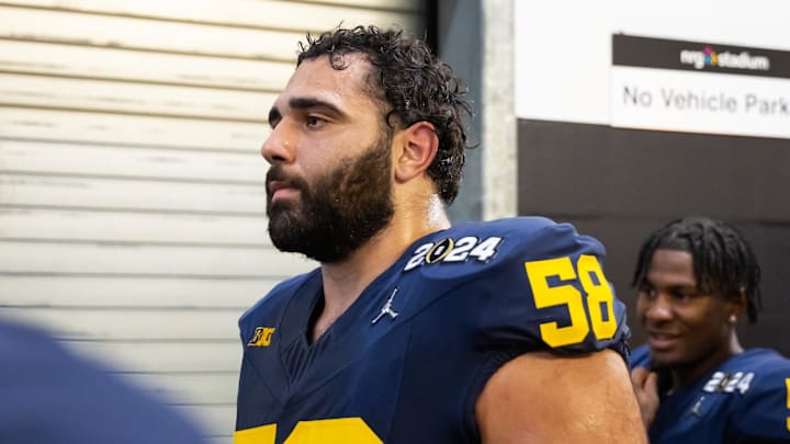 Jan 8, 2024; Houston, TX, USA; Michigan Wolverines offensive lineman Giovanni El-Hadi (58) against the Washington Huskies during the 2024 College Football Playoff national championship game at NRG Stadium.  