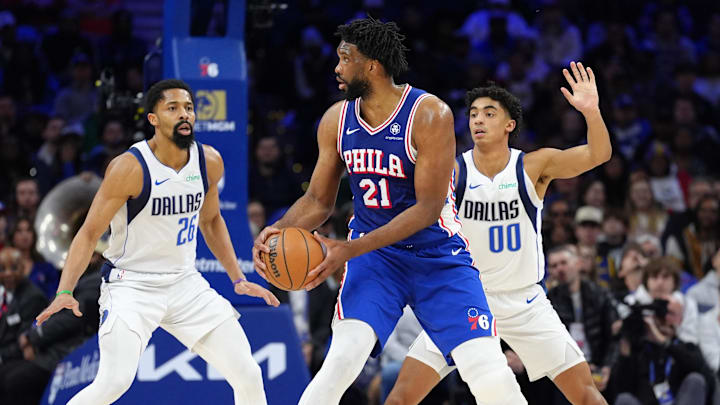 Feb 4, 2025; Philadelphia, Pennsylvania, USA; Philadelphia 76ers center Joel Embiid (21) controls the ball against Dallas Mavericks guard Spencer Dinwiddie (26) and guard Max Christie (00) in the second quarter at Wells Fargo Center. Mandatory Credit: Kyle Ross-Imagn Images