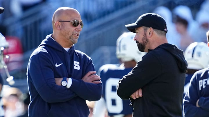 Penn State's James Franklin, left, talks to Ohio State's Ryan Day before a game on Nov. 2, 2024 in University Park, Pa. The Nittany Lions lost, 20-13, pushing Franklin's all-time record against the Buckeyes to 1-10.