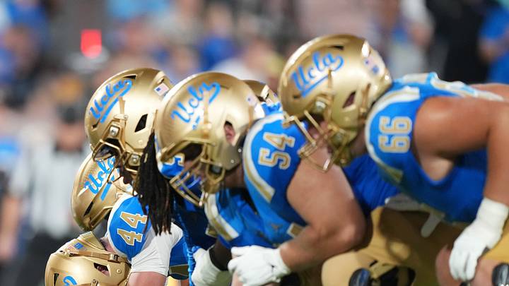 Sep 19, 2026; Pasadena, California, USA; Helmets at the line of scrimmage UCLA Bruins long snapper Giancarlo Cereghino (44) snaps the ball against the Purdue Boilermakers in the first half at the Rose Bowl. Mandatory Credit: Kirby Lee-Imagn Images Sep 19, 2026; Pasadena, California, USA; Helmets at the line of scrimmage UCLA Bruins long snapper Giancarlo Cereghino (44) snaps the ball against the Purdue Boilermakers in the first half at the Rose Bowl. Mandatory Credit: Kirby Lee-Imagn Images