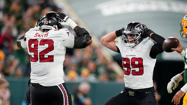 Atlanta Falcons defensive end Cameron Thomas (99) celebrates with defensive lineman Maason Smith (92)