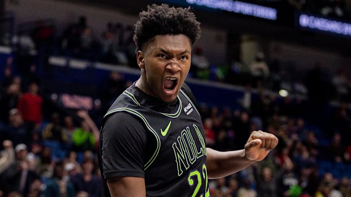 Dec 11, 2025; New Orleans, Louisiana, USA;  New Orleans Pelicans center Derik Queen (22) snugs the ball against Portland Trail Blazers forward Kris Murray (24) during the second half at Smoothie King Center. Mandatory Credit: Stephen Lew-Imagn Images