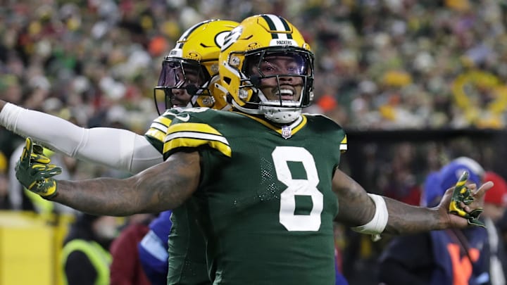 Green Bay Packers running back Josh Jacobs (8) celebrates after scoring a touchdown last year against the 49ers.